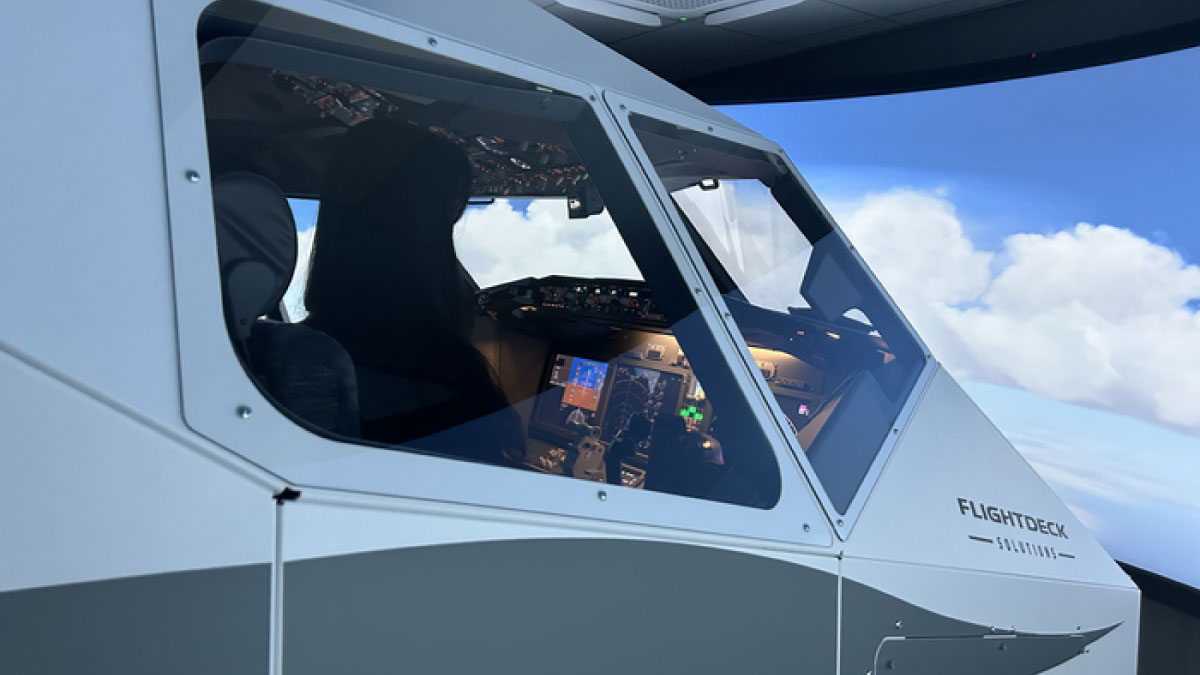 Media demonstration of Eastar Jet's FDS B737MAX flight simulator with Maeil Business Newspaper correspondent experiencing realistic pilot training technology