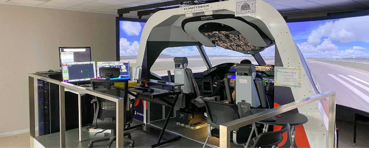 Operational Flightdeck Solutions simulator at Air Premia's South Korean training facility, featuring complete instructor station setup for commercial pilot training and proficiency checks.